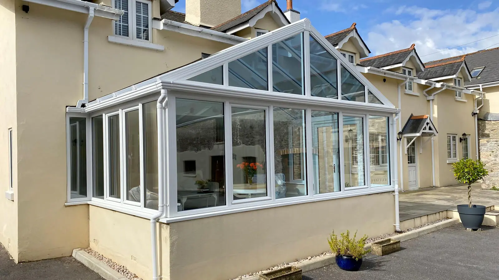 white upvc glass roof conservatory