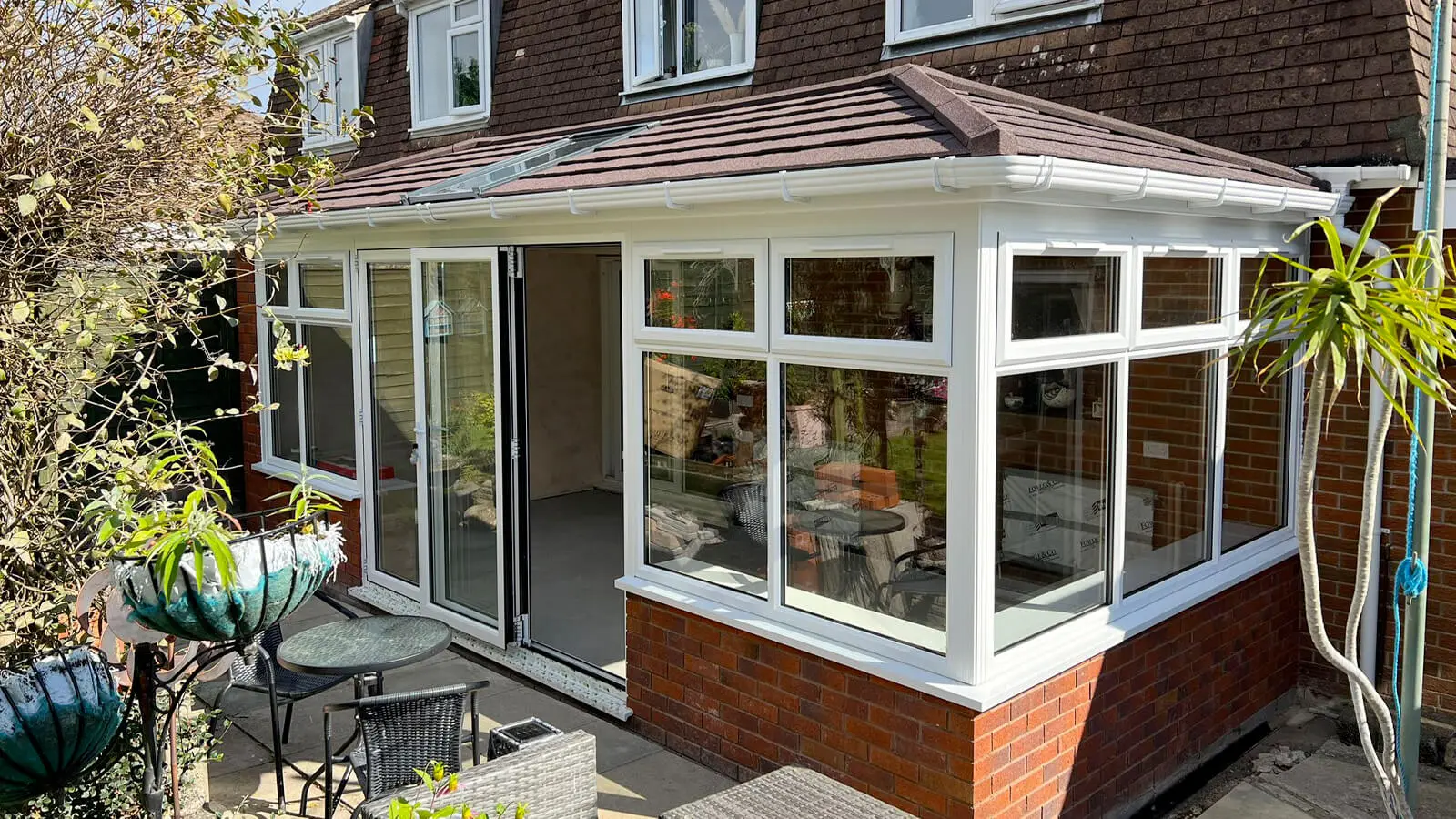 White upvc conservatory with tiled roof